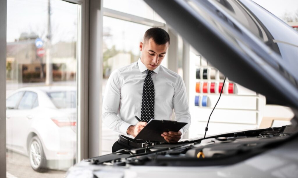 car dealer signing papers 1 1024x684 1