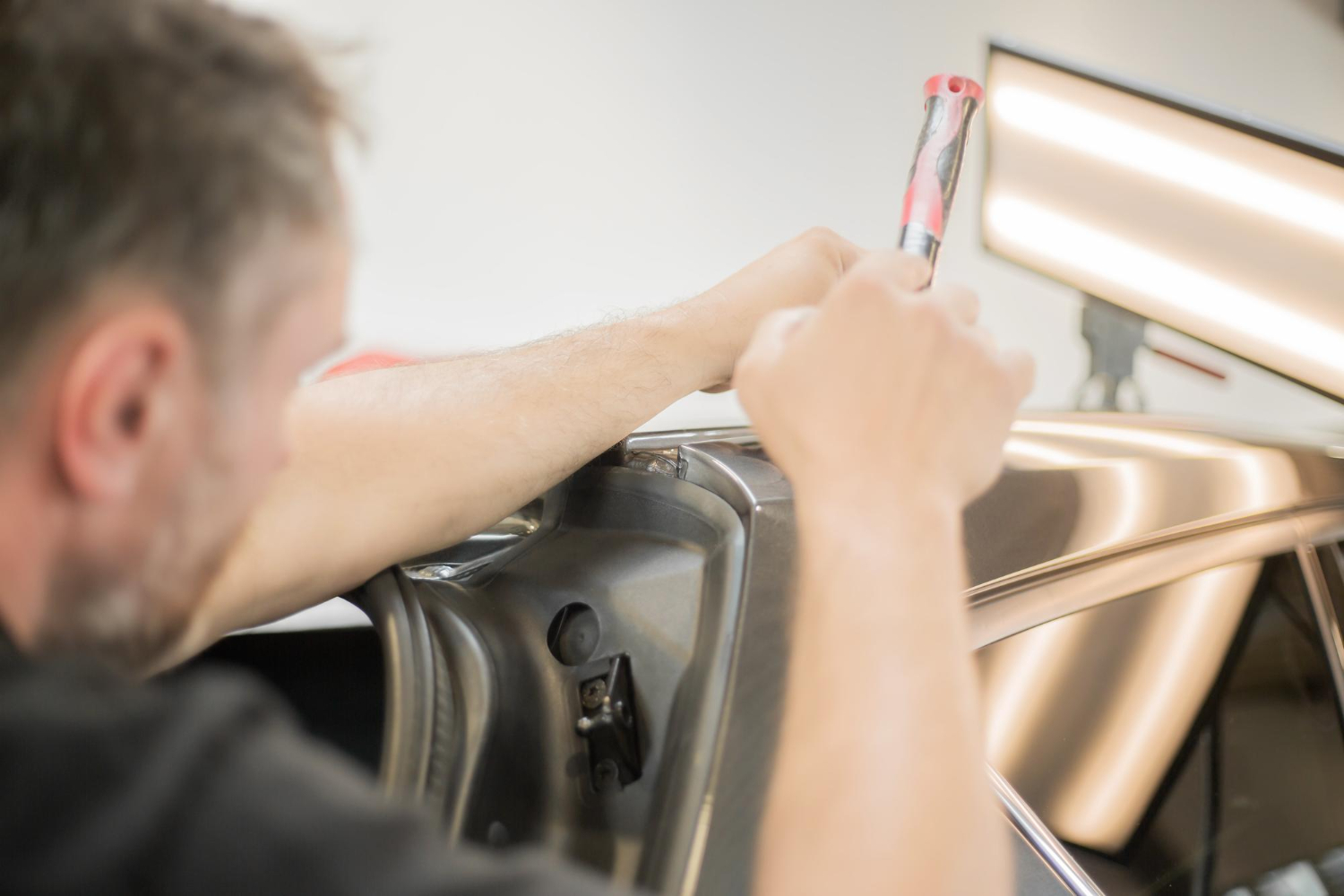 Technician performing frame straightening Brooklyn NY for collision repair