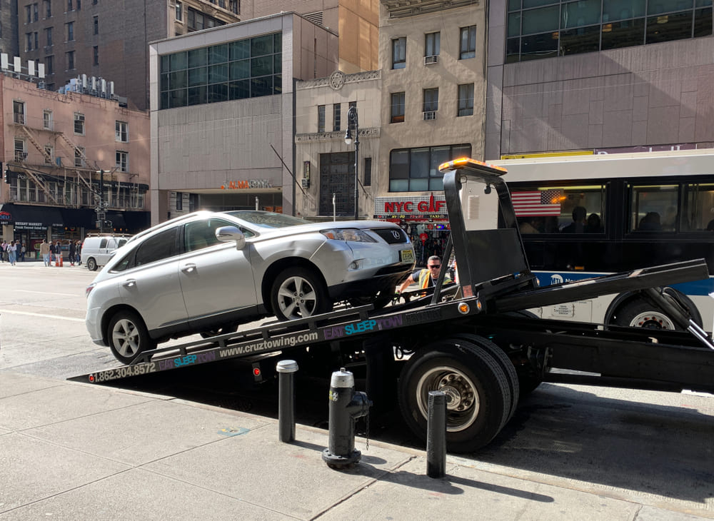 Car towed for expired registration in New York parked on Brooklyn street
