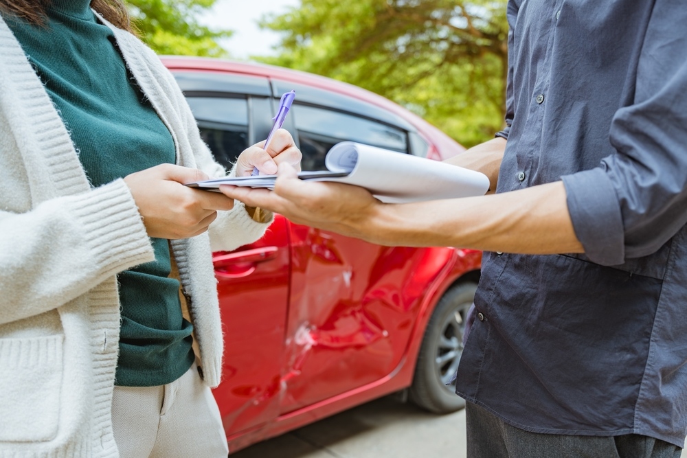 Insurance claims in Brooklyn NY handled by Cyclone Collision Center auto body technician repairing collision damage